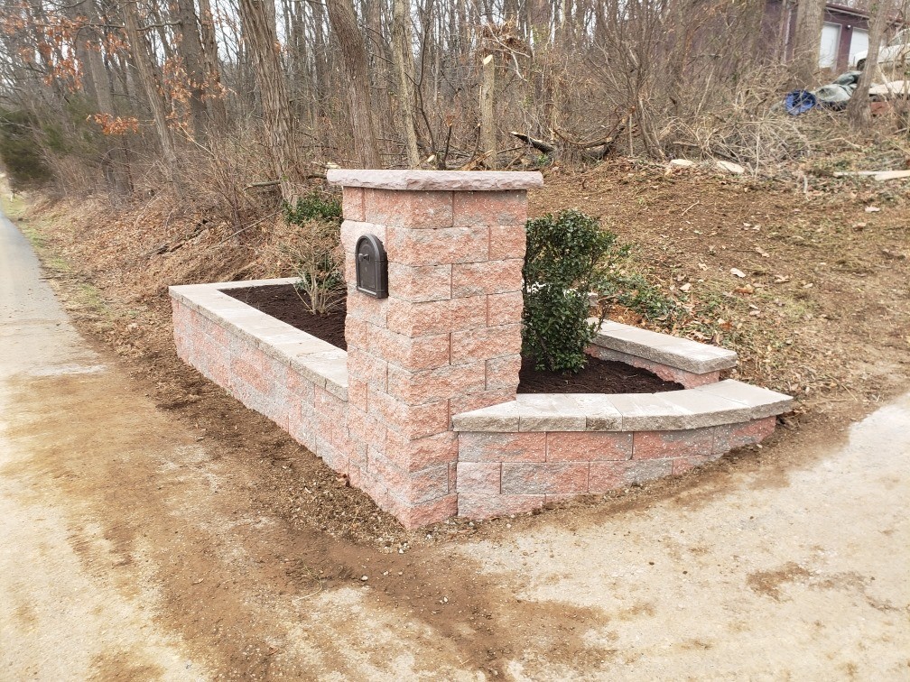 brick mailbox with flower garden