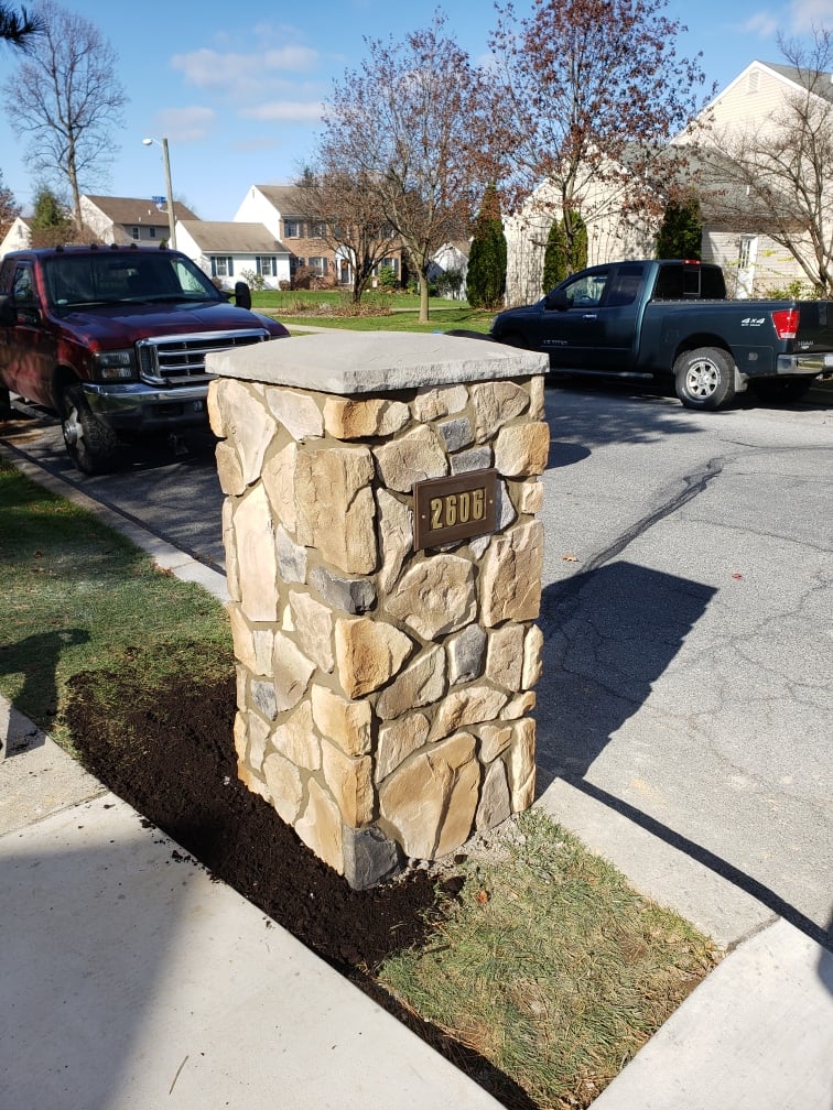 house number on natural stone mailbox