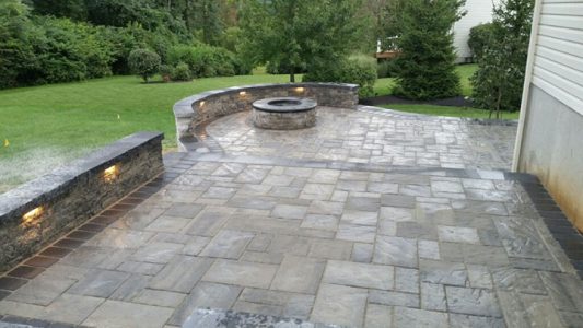 lighting on walls of stone patio