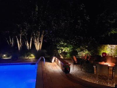 firepit and pool at night