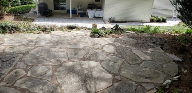 Natural stone Patio built by a hardscaper near me.