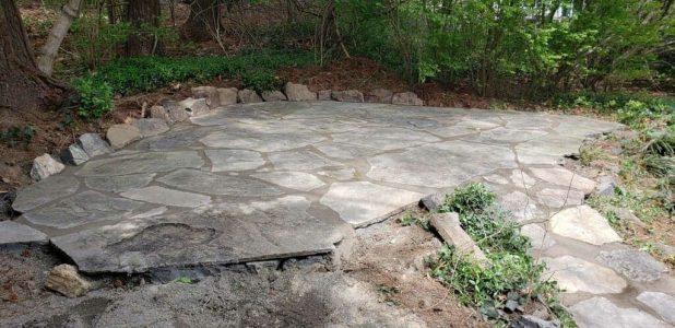 Natural stone Patio built by a hardscaper near me.