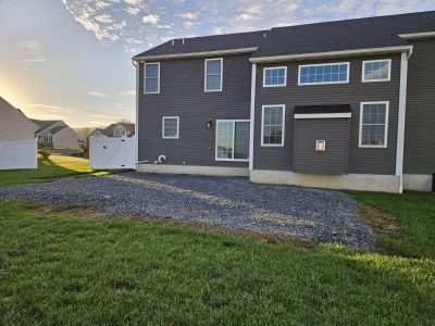 before a new patio is built empty space behind a house set up to build a patio