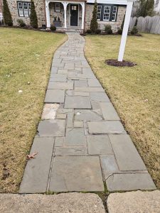 Before: stone walkway with varying sizes that's become very worn and irregular Before: stone walkway with varying sizes that's become very worn and irregular