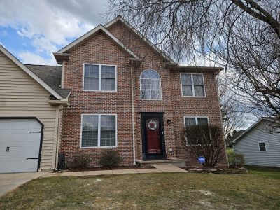 after home facade remodel with bricks