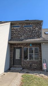 townhome facade renovation with stone veneer